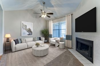 Living room with fireplace and neutral furnishings